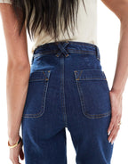 High Rise Flared Jeans with Patch Pockets in Dark Blue Wash